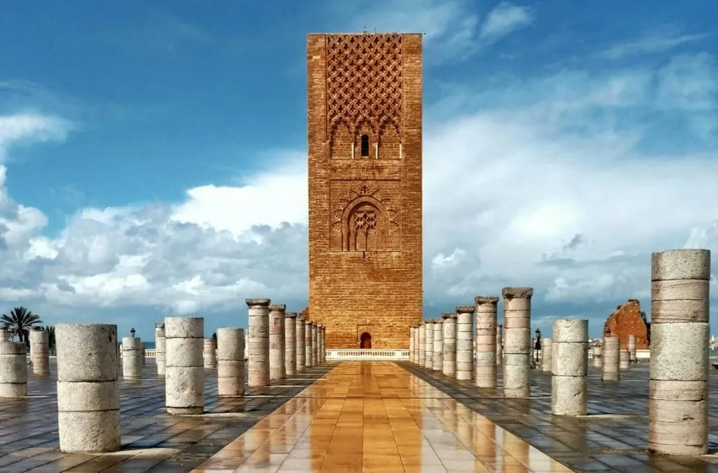 The Hassan Tower and its rows of stone columns in Rabat under a blue sky.